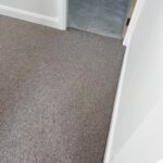 Grey carpet in a bedroom