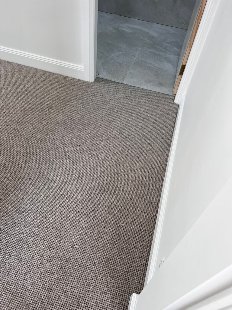Grey carpet in a bedroom