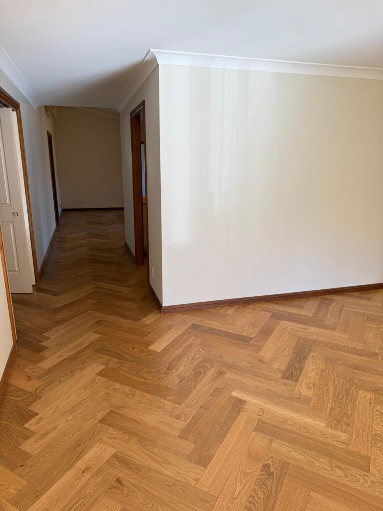 Herringbone timber floor in a bright hallway