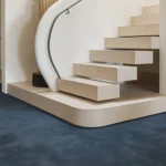 Score woven carpet in Strophic installed in a room